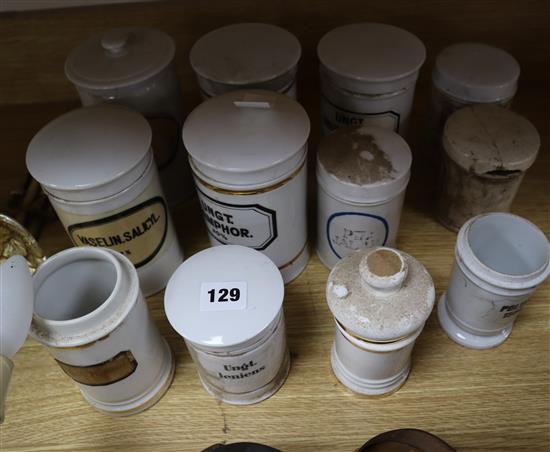 A collection of 19th century Continental ceramic chemists jars, some with lids